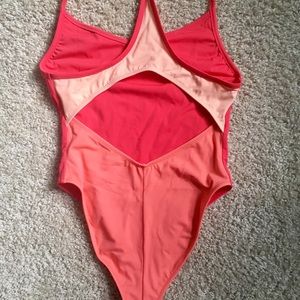 New w/o tags Outdoor Voices one piece coral suit.